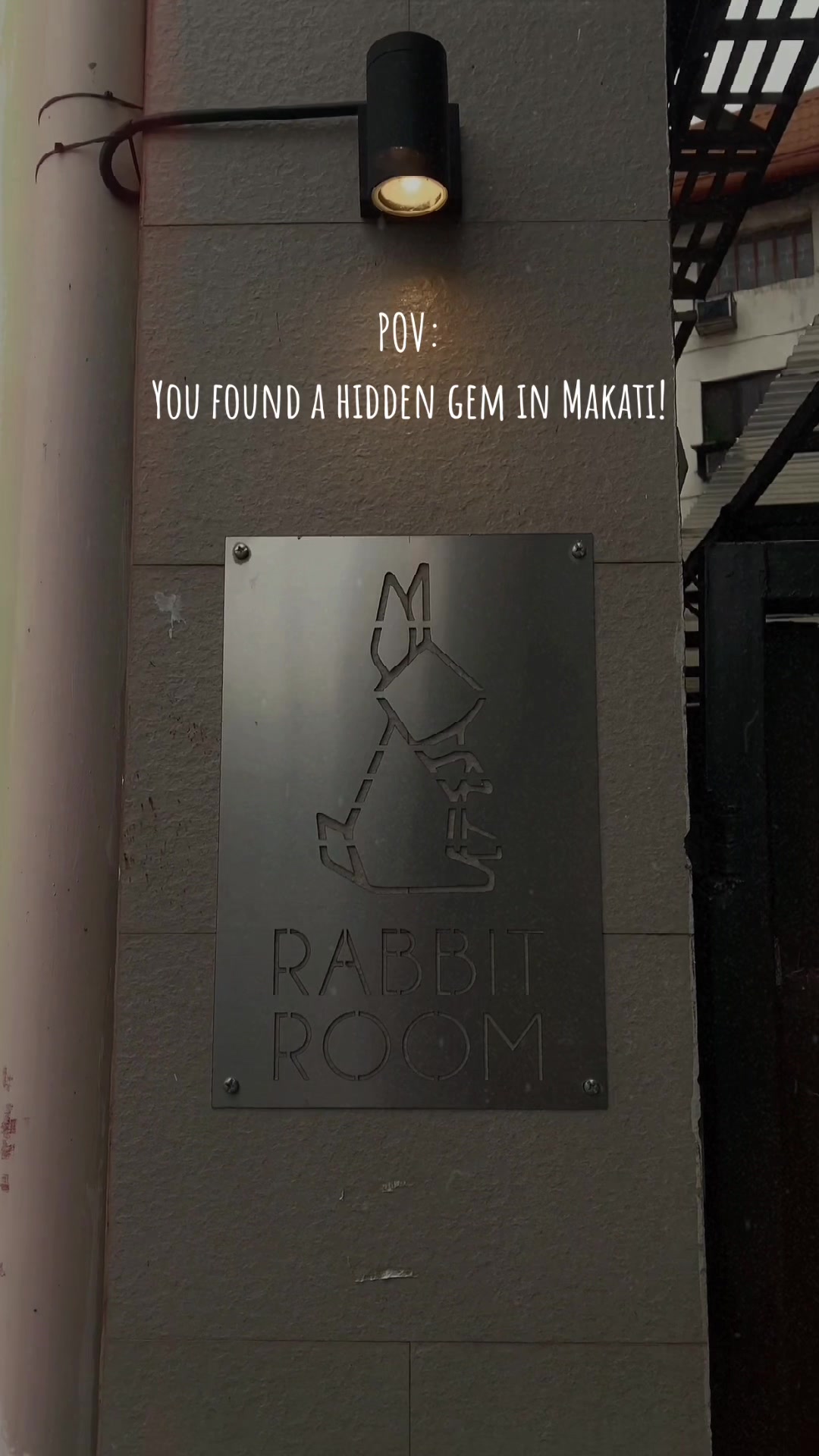 Rabbit Room metal entrance sign - hidden gem in Makati